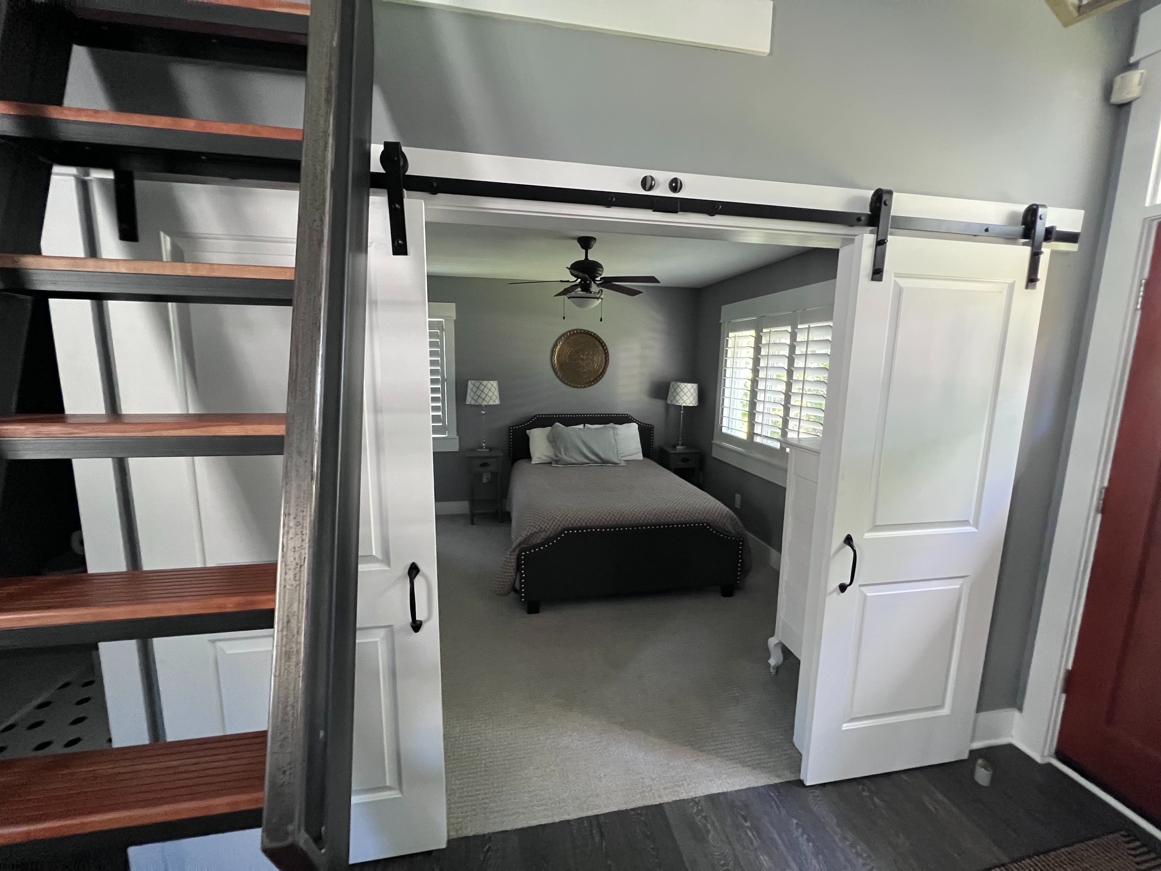 Guest bedroom 2 with french doors and access to shared bathroom