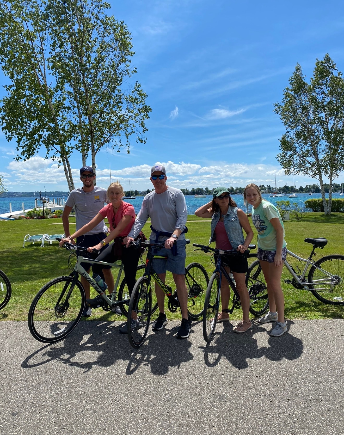 Family group with bikes along the Lake Charlevoix waterfront