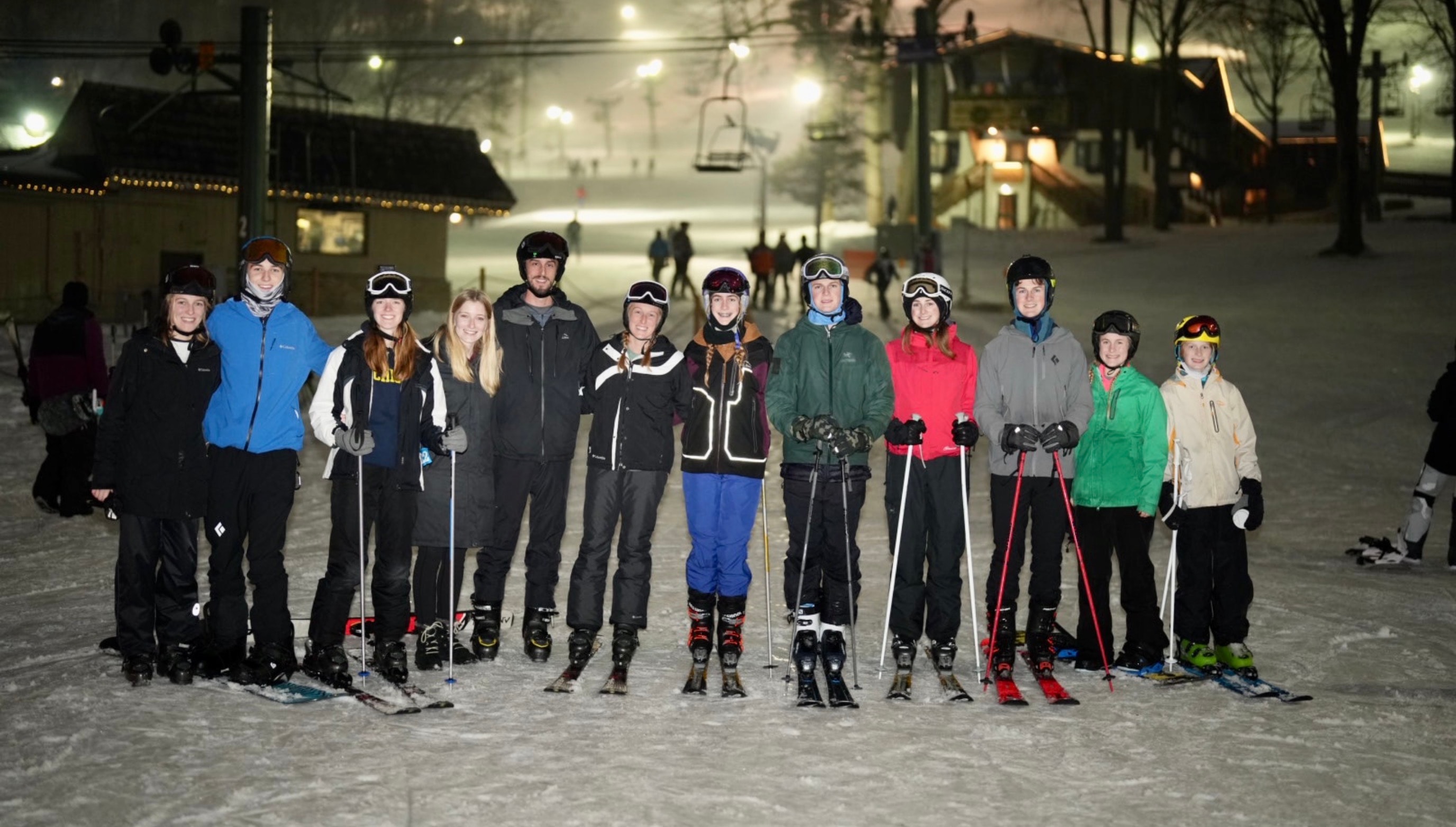 Group of skiers lined up for a night ski at Boyne Mountain
